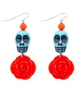 "PAIRE DE BOUCLES D'OREILLES DE CRANE TURQUOISE SUR ROSE ROUGE"