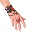 "BRACELET EN DENTELLE AVEC BAGUE ET PIERRES ROUGES"
